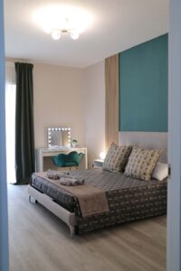 saras-home-apartment-rome-green-room-overview-vertical-web